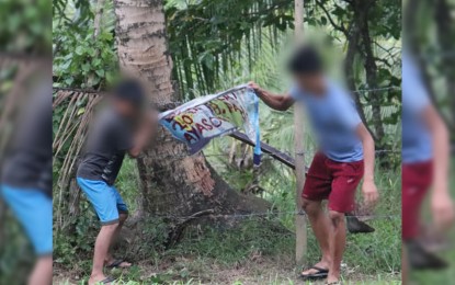 <p><strong>NON-BELIEVER OF NPA IDEOLOGY.</strong>  A social media post by the Philippine Army’s 20th Infantry Battalion on Friday (May 10, 2019) shows children in San Miguel village, Las Navas, Northern Samar removing anti-government propaganda material posted by the New People's Army. The military said children taking down the posters of rebels is proof that the young generation no longer believes the ‘rotten communist’ ideology. <em>(Photo courtesy of Philippine Army 20th Infantry Battalion)</em></p>