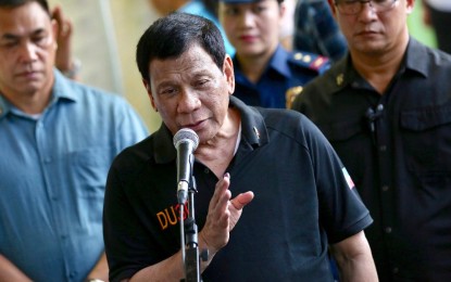 <p>President Rodrigo Roa Duterte answers queries from members of the media after casting his vote for the midterm elections at the Daniel R. Aguinaldo National High School in Davao City on May 13, 2019. <em>(Richard Madelo/Presidential Photo)</em></p>