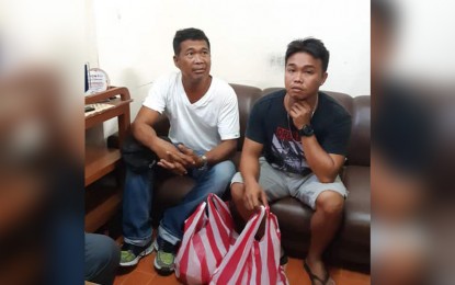 <p><strong>STRANDED CREW.</strong> Ship Captain Romeo Pacres (left) and one of his crew men asks for help from Antique provincial government as their cargo vessel is still stranded in Antique for over a month. The vessel was supposed to transport salt to Bacolod City and Tagbilaran when it was grounded on April 3 2019. <em>(PNA photo by Annabel J. Petinglay)</em><em> </em></p>