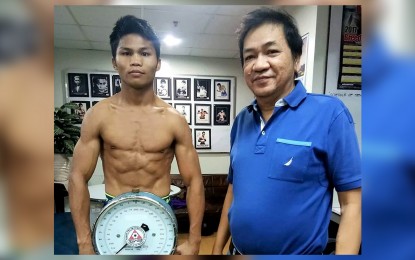 <p><strong>READY FOR IRELAND.</strong> Jelbirt Gomera during his weigh in on May 6 at the Games and Amusement Board in Manila before flying to Belfast for the World Boxing Council International super featherweight title fight against Ryan Burnett. Together with Gomera was a GAB medical doctor. <em>(Photo courtesy of Highland Boxing Promotions)</em></p>