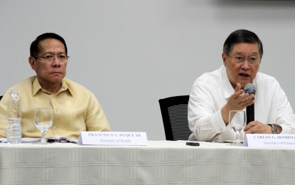 <p><strong>SIN TAX REFORM. </strong><br />Health Secretary Francisco Duque III (left) and Finance Secretary Carlos Dominguez (right) hold a joint press conference on tobacco and alcohol excise taxes at the Department of Finance in Manila on Friday (May 17, 2019). Both Cabinet secretaries pushed for the approval of Senate Bills 1599 and 2197, authored by Senator Manny Pacquiao, which aim to increase sin tax revenues that will be spent on the government's universal health care program. <em>(PNA photo by Gil Calinga)</em></p>