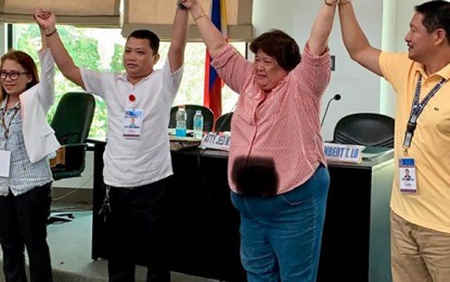 <p><strong>ANOTHER TERM.</strong> The City Board of Canvassers on Saturday (May 18, 2019), proclaims Mayor Rosalina Jalosjos (2nd from right) as the winner in the mayoralty race in Dapitan City, Zamboanga del Norte. Her runningmate, Jimmy Israel Patrick Chan, and nine council aspirants were also victorious. <em>(Photo by  Gualberto M. Laput)</em></p>