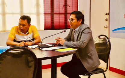<p><strong>PERFORMANCE AUDIT.</strong> Lawyer Naguib Sinarimbo (right), the minister of local government in the Bangsamoro Autonomous Region in Muslim Mindanao, speaks during Wednesday's (May 22) performance audit of peace and order councils (POCs) in the region at Shariff Kabunsuan Complex in Cotabato City. He reminded the POCs that 2019’s routine review would include mechanisms for sanctions and awards for performing groups. <em><strong>(Photo courtesy of MLG-BARMM)</strong></em></p>