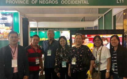 <p><strong>IFEX 2019</strong>. (From left) Hem Villaluna of HLS Aqua Products, provincial agriculturist Japhet Masculino, Metro Bacolod Chamber of Commerce and Industry (MBCCI) president Roberto Montelibano, provincial supervising tourism operations officer Cristine Mansinares, Isabelle Patron of Casa del Formaggio, provincial administrator Lucille Gelvolea, and Jean Jason of MBCCI pose in front of the Negros Occidental booth in the ongoing International Food Exposition (IFEX) Philippines 2019 at the World Trade Center in Pasay City. A total of 18 Negrense exhibitors are participating in the three-day event which runs until Sunday. <em>(Contributed Photo)</em></p>