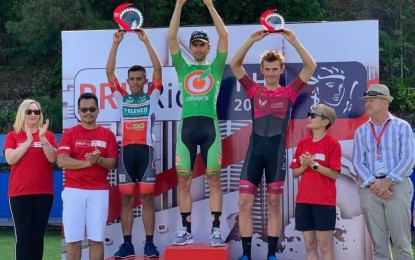 <p><strong>STAGE 2:</strong> South African Brendon Davids (center) raises his trophy after winning the  second stage of the PRURide PH race in Subic, Zambales on Saturday (May 25, 2019). Filipino Marcelo Felipe (left) of 7-Eleven Cliqq Air 21 and New Zealander Michael Vink of Australian continental team St. George finished second and third, respectively. <em>(Photo courtesy of Ric Rodriguez) </em></p>