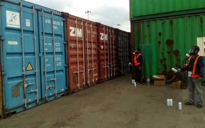 <p>The fumigation of garbage containers from Canada in Subic before being loaded on a ship. <em>(Photo courtesy of DFA Secretary Teodoro Locsin Jr.)</em></p>
<p> </p>