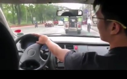 <p>The Land Transportation Office (LTO) is set to revoke the license of a driver who was identified as Miko Lopez after he was seen in a viral video driving his car while on a passenger seat. <em>(Screenshot from DOTr Facebook page) </em></p>