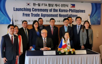 <p><strong>LAUNCH OF PH-ROK FTA NEGOTIATIONS.</strong> The Philippines' Trade and Industry Secretary Ramon Lopez (seated, left) and South Korean Minister for Trade, Industry, and Energy Yoo Myung-hee (seated right) officially launch the negotiations for a PH-ROK Free Trade Agreement (FTA) on Monday (June 3, 2019). With an FTA, the Philippines can achieve improved access into the South Korean market for its agricultural and industrial products. <em>(Photo courtesy of DTI)</em></p>