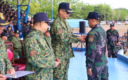 <p><strong>POLICE AWARDEES.</strong> Brig. Gen. Eliseo Tam Rasco, PRO-12 regional director, pins the Philippine National Police’s “Medalya ng Kagalingan” to one of the awardees during conferment ceremonies held on Monday, June 3, inside PRO-12 headquarters in General Santos City. <em><strong>(Photo courtesy of PRO-12)</strong></em></p>