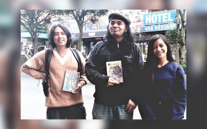 <p><strong>'GAYANG'.</strong> A comic book of 132 pages written and illustrated by senior high students featuring Cordillera mythical creatures finally have a visual representation through the comic book "Gayang". Majic Asbucan (center) and Tor Sagud (left) of Gripo Comics, with apprentice artist Mary Grace Butil (right), hold a copy of the comic book. It will be launched on June  22. <em>(PNA photo by Pigeon M. Lobien)</em></p>
<p> </p>