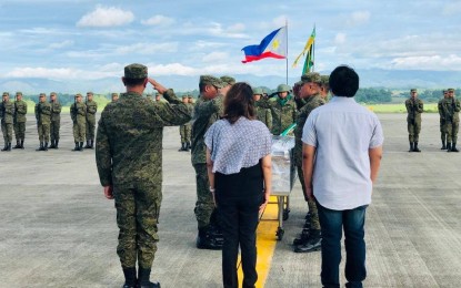 <p><strong>SEND-OFF HONORS</strong>. Maj. Gen. Dinoh Dolina (left), commander of 3rd Infantry Division, leads officials and troops of the Philippine Army in Panay and Negros in the send-off honors for the late Brig. Gen. Francisco Delfin, former commander of the 303<sup>rd</sup> Infantry Brigade in Negros Occidental, at the Iloilo Airport on Friday morning (June 7, 2019). Delfin’s remains were flown to the army headquarters in Fort Bonifacio. <em>(Photo courtesy of  303<sup>rd</sup> Infantry Brigade, Philippine Army)</em></p>