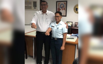 <p><strong>QUEST FOR OLYMPIC GOLD. </strong> Philippine Sports Commission (PSC) chairman William ‘Butch’ Ramirez and Olympic silver medalist Hidilyn Diaz in President Rodrigo Duterte’s signature pose after discussing the latter’s quest for the elusive Olympic gold medal during their meeting at the Philsports arena in Pasig City on June 6, 2019.  Ramirez said the government will fund Diaz’s training in China, with the hope of surpassing the silver medal she won in the weightlifting competition in the 2016 Rio Summer Olympics.  <em>(photo courtesy of PSC)</em></p>
<p><em> </em></p>