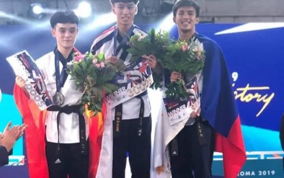 <p><strong>BRONZE MEDALIST</strong>. Filipino Jeordan Dominguez (right) made history when he finished third in the first ever poomsae competition of the World Taekwondo Grand Prix in Rome, Italy Friday (Saturday here). It was the first medal of the Philippines in the World Grand Prix. <em>(Photo courtesy of World Taekwondo Association)</em></p>