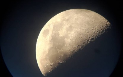 <p><strong>VIEW OF THE MOON</strong>. A peek at Monday night's moon through a telescope during the One Starry Night: Meet EUr Astronomers event at the SM Aura Premier. <em>(Photo courtesy of EU Delegation in Manila)</em></p>