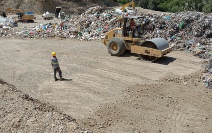 <p><strong>BINALIW LANDFILL.</strong> Service crew are seen capping with soil after spraying with neutralizing agents and deodorizers to the garbage brought to the Arn Central Waste Management landfill in Barangay Binaliw, Cebu City on Monday, June 10, 2019. The landfill management ensured the Environmental Management Bureau (EMB-7) and the residents in Binaliw to seal their process to avoid further environmental hitches in the future. <em>(Contributed photo)</em></p>