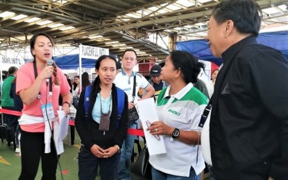 <p><strong>HIRED.</strong> Around 30 job applicants were hired on the spot during the Kalayaan job and business fair in Baguio City on June 12. Among those hired on the spot was 29-year-old Karen Lang-ay (2<sup>nd</sup> from left) who applied as nurse in Jeddah, Saudi Arabia. <em>(Photo by Liza T. Agoot/PNA)</em></p>