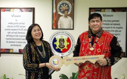 <p><strong>NEW LEADERSHIP</strong>. Outgoing National Commission on Indigenous Peoples chair Leonor Oralde-Quintayo (left) personally hands over a symbolic key to retired colonel Allen Capuyan during a ceremony at the NCIP office in Quezon City on Friday (June 14, 2019). <em>(PNA photo by Jess Escaros Jr.)</em></p>