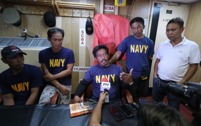 <p><strong>SAFE AND SOUND</strong>. One of the 22 fishermen of the sunken F/B Gemvir 1 answers questions from the media aboard the Philippine Navy vessel BRP Ramon Alcaraz. The China Embassy has confirmed it is a China-flagged vessel that hit the Filipino fishermen’s boat anchored at Reed Bank in the West Philippine Sea, causing it to sink. (PNA<em> photo by Joey Razon)</em></p>