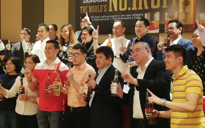 <p><strong>WORLD’S BEST. </strong> Officials and employees of Tanduay Distillers, Inc. celebrate a milestone after the 165-year-old company was recently named top favorite in the rum category for two consecutive years by Drinks International. Drinks International is a global spirits market organization which rewards the greatest drinks in different categories. <em>(PNA photo by Ma. Teresa Montemayor)</em></p>