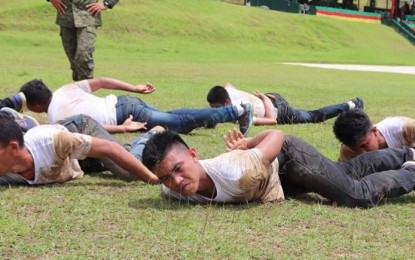 <p><strong>FORTIFYING THE FORCE.</strong> Recruits of the Philippine Army's 3rd Infantry Division (3ID) crawl across the field during training. The 256 Army recruits are expected to embrace the service to the Filipinos and the nation above everything else, Capt. Cenon Pancito, 3ID's spokesperson said on Monday (June 17, 2019). <em>(Photo courtesy of Philippine Army Spearhead Troopers)</em></p>