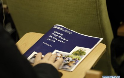 <p>A journalist holds a copy of the World Population Prospects 2019: Highlights, at the UN headquarters in New York, on June 17, 2019.  The world's population is expected to increase by 2 billion in the next 30 years, from 7.7 billion currently to 9.7 billion in 2050, according to a United Nations report released here on Monday. <em>(Xinhua/Li Muzi)</em></p>