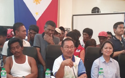 <p><strong>DENOUNCING 'ACT OF ABANDONMENT'. </strong>Agriculture Secretary Emmanuel “Manny Piñol” (center) speaks in a press conference together with the 22 fishermen affected by the Recto Bank incident at the San Jose Municipal Hall in Occidental Mindoro on Wednesday (June 19, 2019).They denounced the act of abandonment of the crew of the Chinese vessel after ramming their boat.<em> (PNA photo by Lilybeth G. Ison) </em></p>