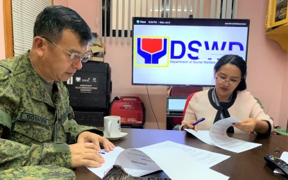 <p><strong>MOA SIGNING.</strong> Department of Social Welfare and Development-Cordillera Director Janet Armas and  Philippine Army 503rd Infantry Brigade<em> </em>Commander Brigadier General Henry Doyaoen<em> </em>sign a Memorandum of Agreement for the faster delivery of relief and food packs before and during calamities. In the Cordillera region, there are warehouses in Apayao, La Trinidad in Benguet, and Kalinga, that are set up at the Army headquarters through a memorandum of agreement. <em>(File photo courtesy of DSWD-CAR Facebook)</em></p>