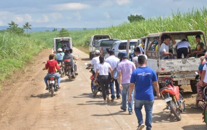 <p><strong>ROAD DEVELOPMENT. </strong>Officials of the provincial government of Negros Occidental and the Department of Agriculture walk through a portion of the 4.7-kilometer Sitio Magtuod to Sitio Vergara farm-to-market road in Barangay Bug-ang in Toboso town which formally opened on Wednesday (June 19, 2019). The PHP61.6-million road, implemented under the Department of Agriculture-Philippine Rural Development Project, will benefit 448 households and also provide accessibility to teachers and pupils of Vergara Elementary School. (Photo courtesy: Richard Malihan/Negros Occidental Capitol PIO)</p>