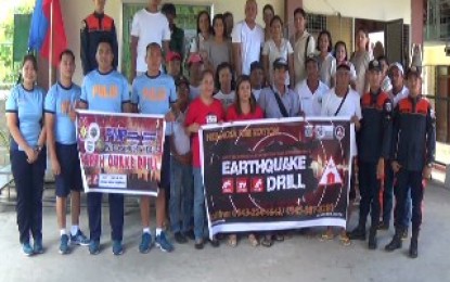 <p><strong>EARTHQUAKE DRILL.</strong> Village, fire, police and Municipal Disaster Risk Reduction and Management Office officials, along with teachers of the Almacen Elementary School in Hermosa, Bataan, conduct an earthquake drill with more than 400 pupils on Thursday (June 20, 2019). The exercise was done simultaneously in schools and government offices nationwide. <em>(Photo by Ernie Esconde)</em></p>
