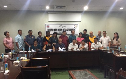 <p><strong>AIMING FOR CHAMPIONS.</strong> The Iloilo provincial government and five pilot schools sign a Memorandum of Agreement (MOA) for the varsity program on Monday (June 17, 2019). The partnership of the schools and the  province will support the training of varsity team members and training pool athletes in various sports.  <em>(Photo courtesy of Ray Cabarles)</em></p>