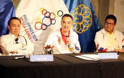 <p><strong>SEA GAMES PREPARATION. </strong> Philippine Southeast Asian Games Organizing Committee (PHISGOC) chairman Alan Peter Cayetano (center) clarifies that PHISGOC will remain as organizing body of the 30th Southeast Asian Games in a press conference at the Kabisera Restaurant in BGC, Taguig City on Thursday (June 20, 2019).  Cayetano, accompanied by PHISGOC vice chairman Abraham Tolentino (left) and chief operation officer Ramon Suzara (right), made the remark due to the resignation earlier of Ricky Vargas as president of the Philippine Olympic Committee (POC). <em>(PNA photo by Jess M. Escaros Jr.)</em></p>
