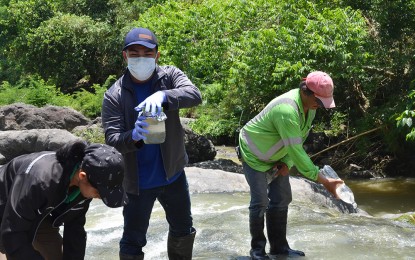 <p><strong>WATERWAYS INSPECTION.</strong> A team led by the Department of Environment and Natural Resources (DENR) collects water samples to determine if waterways are contaminated with effluents from the Wacuman Sanitary Landfill in Norzagaray, Bulacan on Friday (June 21, 2019). The inspection was done in response to residents' clamor for a resolution to the mounting garbage problems in the province. <em>(Photo by Manny Balbin)</em></p>