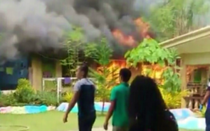 <p><strong>BURNING.</strong> Flames raze the two-classroom building of the Isidoro Lonzaga Memorial Elementary School in Barangay Magsaysay, Kidapawan City on Friday (June 21, 2019). Investigators have yet to determine the cause of the fire. <em>(Photo courtesy of the ILMES faculty)</em></p>