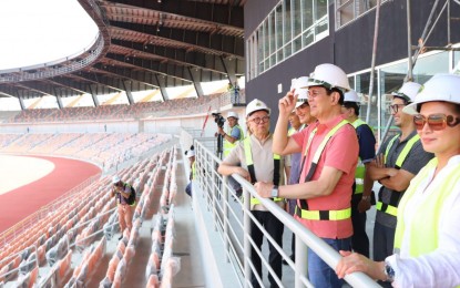 <p><strong>SEA GAMES VENUE. </strong> Senator Panfilo Lacson (in red shirt) appears pleased with the nearly finished 20,000-seater Athletics Stadium at the New Clark City sports complex in Pampanga during a recent tour led by Bases Conversion and Development Authority (BCDA) President and CEO Vince Dizon. Lacson said the venue of the 30th Southeast Asian Games later this year was the fruit of "political will". <em>(Photo courtesy of BCDA)</em></p>