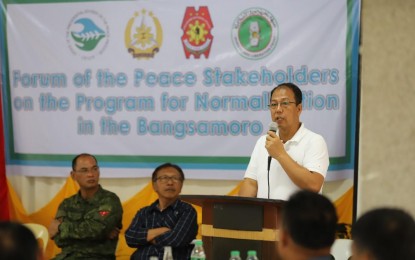<p><strong>NORMALIZATION.</strong> Presidential Peace Adviser Carlito G. Galvez Jr. delivers his message during a recent multi-stakeholder forum on Normalization in Basilan City, Isabela.  Galvez stressed the value of the Normalization process as the government and the Moro Islamic Liberation Front work hand-in-hand towards rebuilding the lives of former combatants, their families and communities. <em>(Photo courtesy of OPAPP)</em></p>