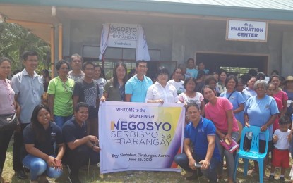 <p><strong>CAPACITATING SMALL ENTREPRENEURS.</strong> Edna Dizon (in white blouse), provincial director of the Department of Trade and Industry, together with local officials and residents pose during the launching of the DTI's "Negosyo Serbisyo sa Barangay" in Barangay Simbahan, Dinalungan, Aurora on Tuesday (June 25, 2019). The program aims to capacitate business entrepreneurs in the villages. <em>(Photo courtesy of the DTI provincial office)</em></p>