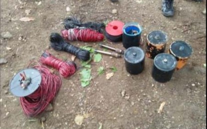 <p>Recovered improvised explosive devices in the vicinity of an alleged New People's Army lair in Manjuyod, Negros Oriental. <em>(Photo courtesy of the Negros Oriental Provincial Police Office) </em></p>