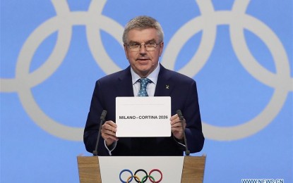 <p><strong>NEXT HOST</strong>. President of the International Olympic Committee (IOC) Thomas Bach announces Milan-Cortina d'Ampezzo of Italy to host the 2026 Winter Olympic Games during the 134th session of International Olympic Committee (IOC) in Lausanne, Switzerland, June 24, 2019.  It will be the third time for Italy to host the Winter Olympic Games. <em>(Xinhua/Cao Can)</em></p>