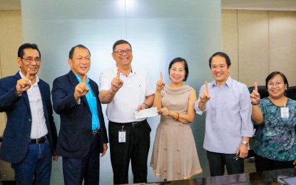 <p><strong>PAGCOR AID FOR SEA GAMES</strong>. Philippine Amusement and Gaming Corporation (PAGCOR) chairperson Andrea Domingo (third from right) and Philippine Sports Commission (PSC) chairman William Ramirez (third from left) pose with other officials during the turnover of the PHP842.5-million check to renovate sports venues for the 30th SEA Games at the PAGCOR office in Manila on Wednesday (June 26, 2019). The Philippines will host for the fourth time the SEA Games from Nov. 30 to Dec. 11 this year.<em> (Photo courtesy of PSC)</em></p>
