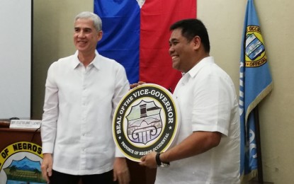 <p><strong>TURN-OVER.</strong> Outgoing Negros Occidental vice governor Eugenio Jose Lacson (left) turns over the leadership of the Office of the Vice Governor to former fourth district representative Jeffrey Ferrer during the Provincial Board's last session under his watch on Wednesday afternoon (June 26, 2019). Lacson will take over as governor on June 30. <em>(PNA photo by Nanette L. Guadalquiver)</em></p>