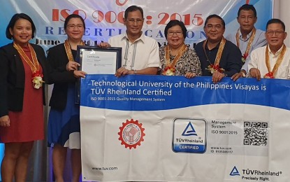 <p><strong>ISO CERTIFICATION.</strong> (From left) Luna Villacrusis and Isabel Tiu of TUV Rheinland, TUP president Jesus Rodrigo Torres, vice president for planning and development Ma. Leonor Validor, TUPV campus director Eric Malo-oy, assistant directors Joshua Berja and Nelson Franco during the awarding of the ISO 9001:2015 recertification to TUP Visayas last June 11 at the Nature’s Village Resort in Talisay City. The ISO 9001 ensures quality orientation by the core processes to optimize the university’s management system. <em>(Contributed Photo)</em></p>