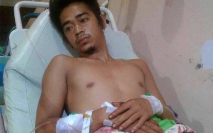 <p><strong>AMBUSH SURVIVOR.</strong> Lone ambush survivor, Kimboy Fernalino, a Teduray indigenous community member, undergoes treatment at the hospital following their ambush on Wednesday night (June 26) with two other companions who died in the incident at Barangay Saniag, Ampatuan, Maguindanao. The fatalities in the ambush were Teduray community chieftain Orlando Santos, and his son Michael, both residents of Saniag village. <em><strong>(Photo courtesy of Ampatuan MPS)</strong></em></p>