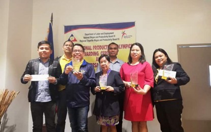<p><strong>MODEL ENTERPRISES.</strong> Winners of the Productivity Olympics 2019 of the Department of Labor and Employment Western Visayas (DOLE 6) pose for a photo after an awarding ceremony in a hotel in this city's Mandurriao district on Monday (July 1, 2019).  DOLE 6 noted the best practices of the winners should serve as examples to other companies and enterprises. <em>(PNA Photo by Gail Momblan)</em></p>