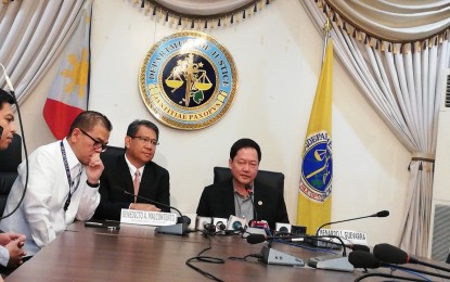 <p><strong>WARNING VS. KAPA. </strong>Justice Secretary Menardo Guevarra (right) warns members of Kapa-Community Ministry International Inc. to refrain from soliciting contributions in a press conference on Tuesday (July 2, 2019).  The DOJ chief said this act of Kapa members can be considered a "continuing offense" since criminal charges for violation of the Securities Regulation Code (SRC) had already been filed against the firm's officials. <em>(PNA photo by Benjamin Pulta)</em></p>
<p> </p>