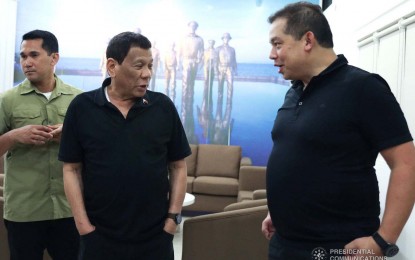 <p>President Rodrigo Duterte (left) shares a light moment with Leyte Rep. Martin Romualdez.</p>
