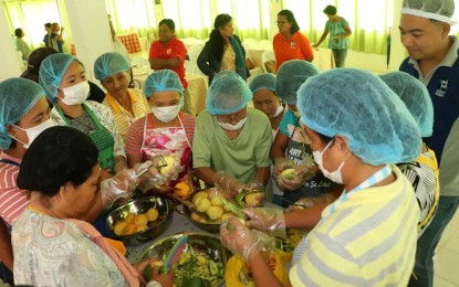 <p><strong>ADDING VALUE TO MANGOES.</strong> Members of agri-groups in Pangasinan join the training on mango value-adding processing in Alaminos City on June 27-28, 2019. The products are vinegar, jams, pastillas, and pickles, which are expected to cater to the taste buds of tourists visiting Hundred Islands National Park. <em>(Photo courtesy of Alaminos City FB page)</em></p>