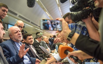 <p><strong>OUTPUT CUT</strong>. Iranian Minister of Petroleum Bijan Namdar Zanganeh (1st L, front) talks to the press at a meeting of the Organization of the Petroleum Exporting Countries (OPEC) in Vienna, Austria, July 1, 2019. The OPEC and non-OPEC oil producers agreed here on Monday to extend the output cut by nine months. <em>(Xinhua/Guo Chen)</em></p>