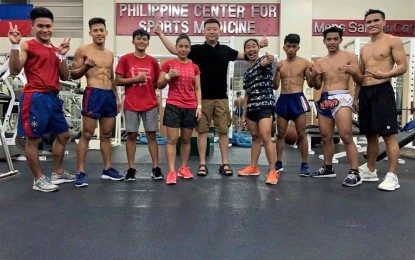 <p><strong>NEW KID ON THE BLOCK.</strong> Wushu sanda player Gideon Padua (2nd from right) will leave for Chengdu, Sichuan, China on July 7 with the 9-men/women Philippine wushu sanda team for their four-months training in preparation for the SouthEast Asian Games. Also in the photo are Divine Wally (4th from left), Arnel Mandal, Carlos Baylon, unidentified non-Philippine team member, Coach Zheng Lei, Jennifer Kilapio, Russel Diaz, Padua, and Clemente Tabugar.<em> (File photo courtesy of WFP)</em></p>
