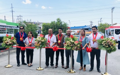 <p><strong>PUV MODERNIZATION PROGRAM</strong>. The Department of Transportation (DOTr) and Land Transportation and Franchise Regulatory Board (LTFRB), in partnership with SM City Pampanga, launch on Friday (July 5, 2019) the Public Utility Vehicle (PUV) modernization program caravan in Pampanga. (From L-R) Manny Camagay, head of the Office of Transport Cooperatives (OTC) PUVMP-Project Management Office; Raquel Anzures, senior manager of the Development Bank of the Philippines (DBP); Ahmed Quizon, Regional Director of LTFRB; Eldon Joshua Dionisio, Senior Transport Development DOTr Undersecretary-Road Transport and Infrastructure; Aaron Jeffrey Montenegro, SM City Pampanga mall manager; Jeanette Mercado, Supermall Transport Services Inc.-special project manager; and Mario Ojales, department head of CV Dealer Sales Division, officially open booth for modernized jeepneys through a ribbon cutting.  <em>(Photo by Marna Dagumboy-Del Rosario)</em></p>