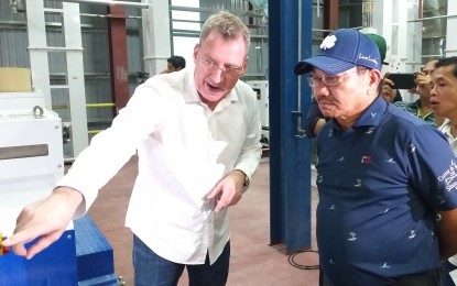 <p><strong>POINT MAN.</strong> Agriculture Secretary Emmanuel Piñol is toured by Chen Yi Agventures Rice Processing Center owner Patrick François Renucci inside the world-class facility in Leyte on Friday (July 5, 2019). President Rodrigo Duterte confirmed Piñol is leaving his post to be his “point man” in the Mindanao Development Authority. <em>(PNA photo by Sarwell Q. Meniano)</em></p>